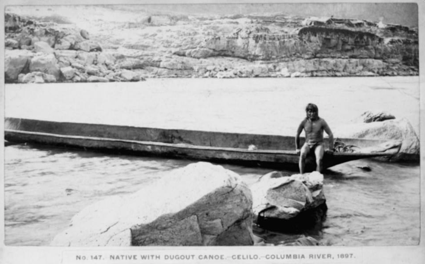 Native man in canoe on Columbia River Native man in canoe on Columbia River