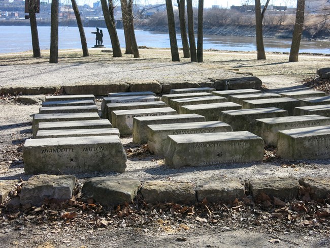 stone benches by river