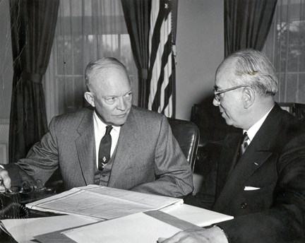 President Eisenhower speaks to a man in the oval office