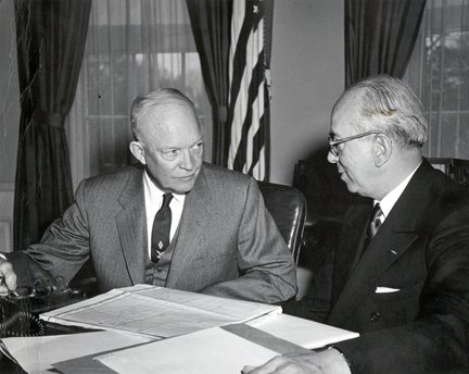 Eisenhower and Strauss President Eisenhower speaks to a man in the oval office