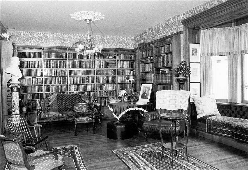 Black and white photo of an old private library.