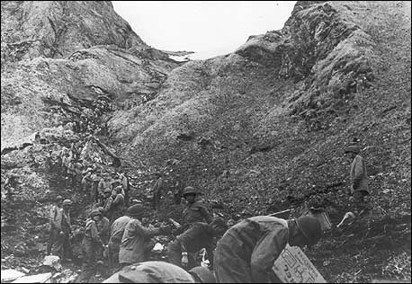 B&W image of troops in a trench