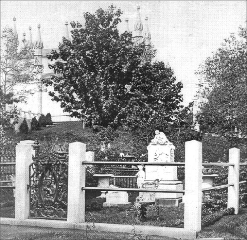 Photo of enclosed headstone.