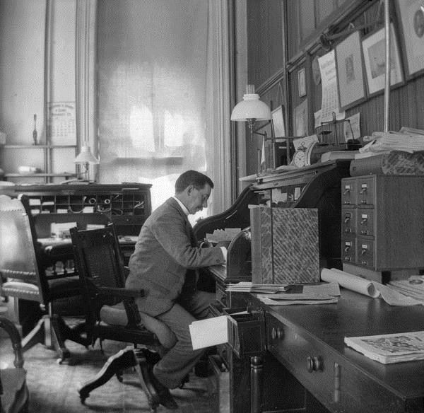 860 man sitting at a desk