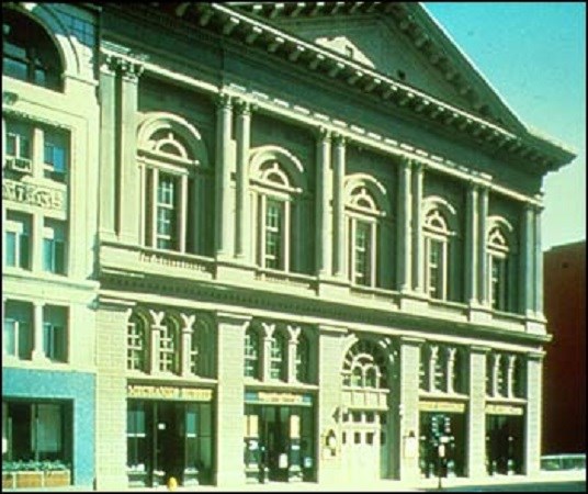 Outside of a large ornate building.
