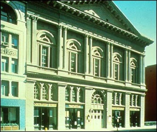 Outside of a large ornate building.