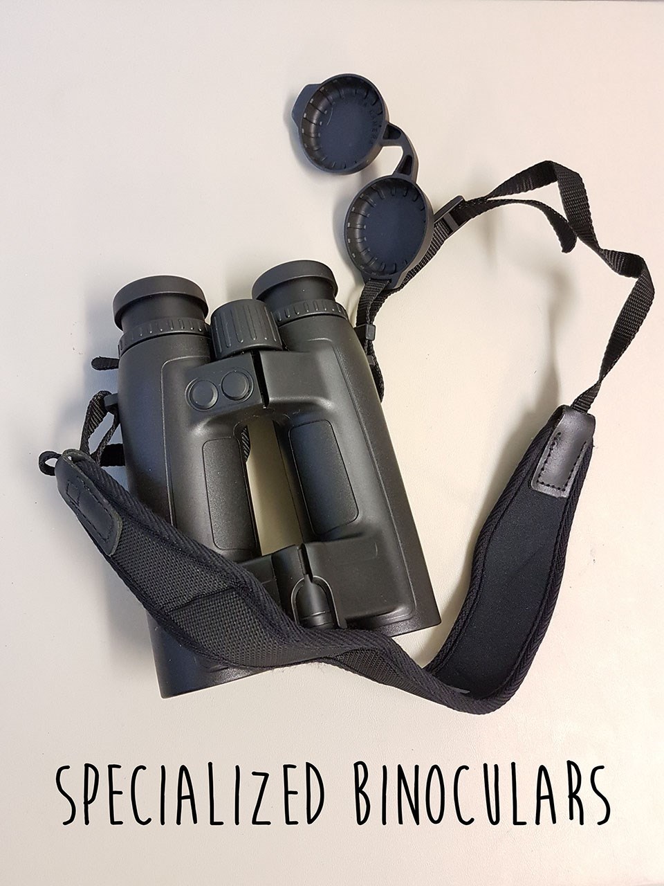 a pair of black binoculars on a white background with text reading Specialized Binoculars laid over top