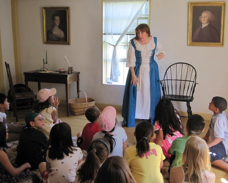 Living historian portraying Abigail Adams to a school group