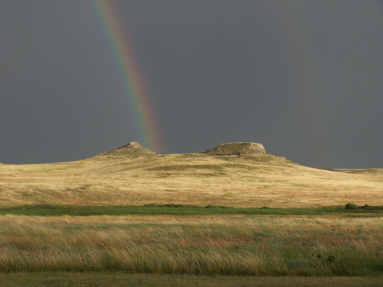 AGFO Fossil Hills Double Rainbow Double rainbow over a hill in a prairie