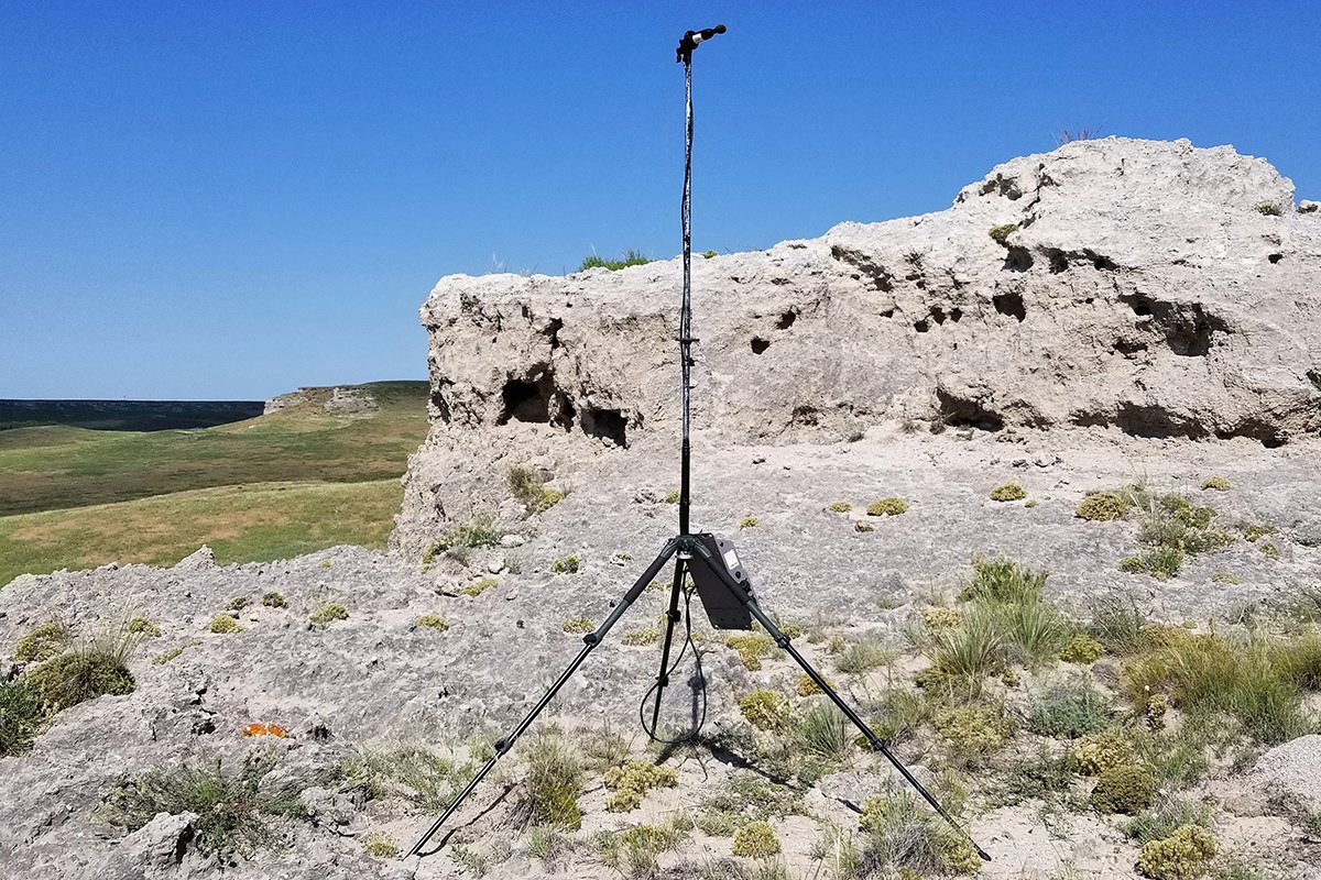 Acoustic monitoring station at Agate Fossil Beds National Monument Bat acoustic monitoring equipment next to a rock outcropping