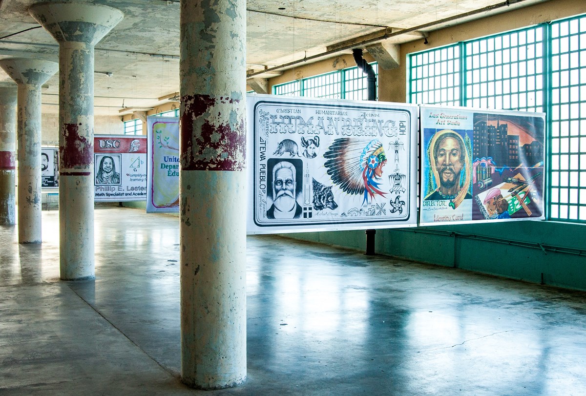 Hand drawn identification cards hang in between industrial pillars Hand drawn identification cards hang in between industrial pillars
