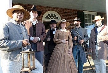 APCO Civil War Reenactors Civil War era reenactors standing on a porch
