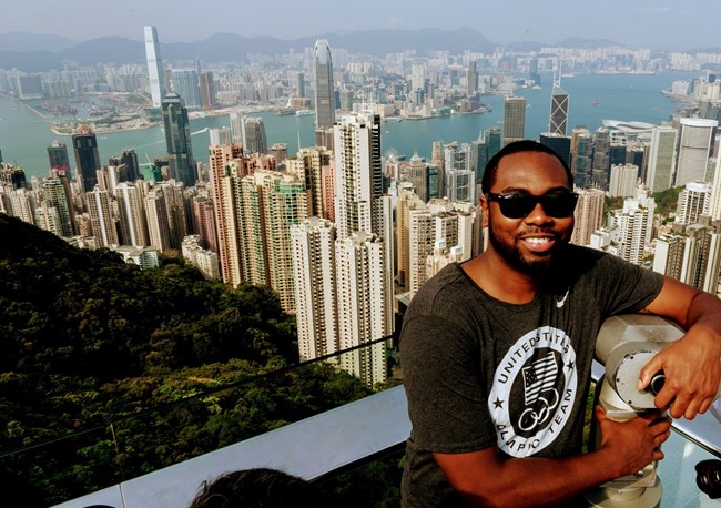 Aaron Adams against the Hong Kong skyline Aaron Adams with the Hong Kong skyline