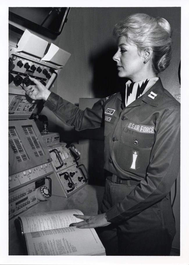 Female air force officer at an electronic console