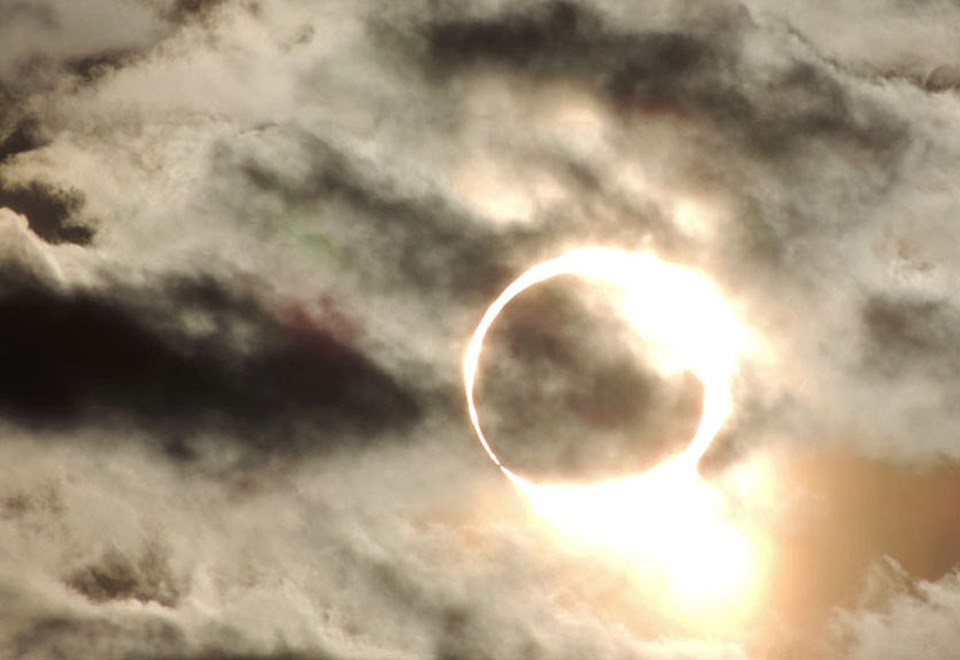 A view of the "ring of fire" around the sun during the 2012 annular eclipse. The eclipsed sun is partially obscured by clouds.