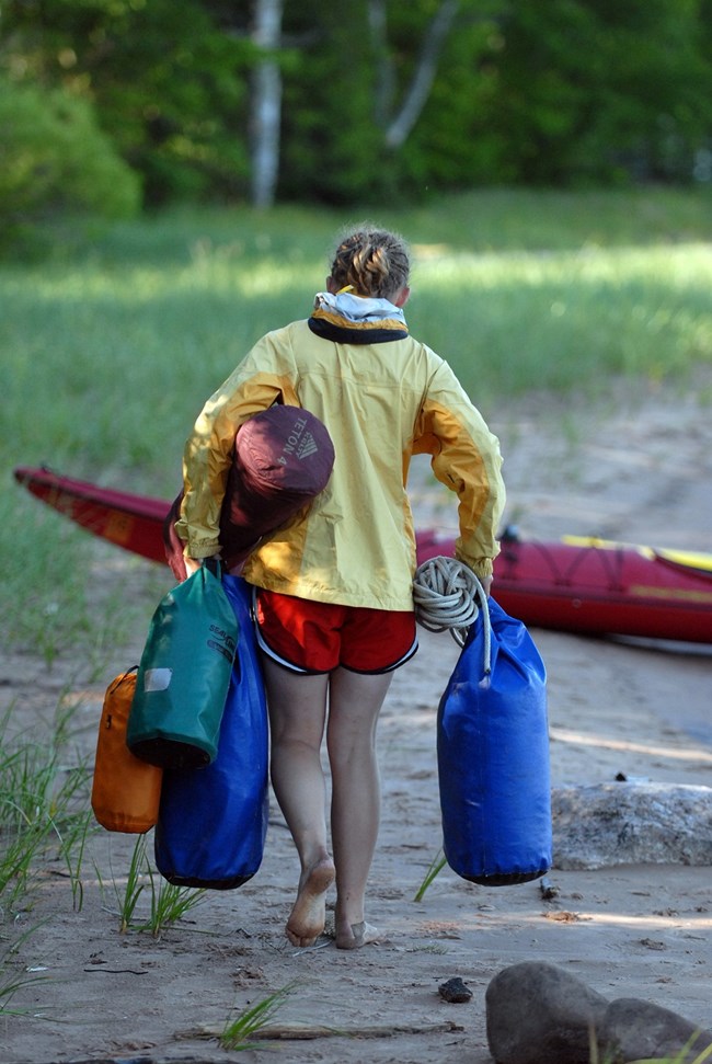 Kayaker packing up after a long day Kayaker packing up after a long day