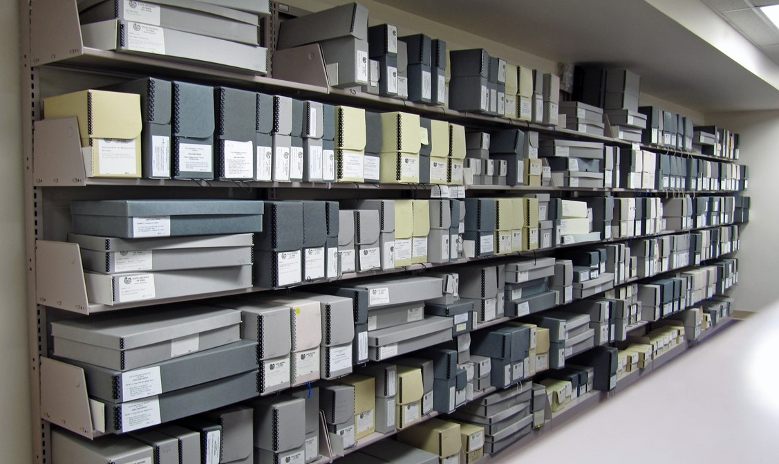 Shelves of file folders and containers.