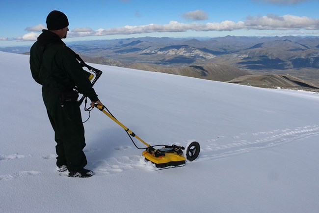 An archaeologist uses ground-penetrating radar to search for archaeological sites in the Arctic.