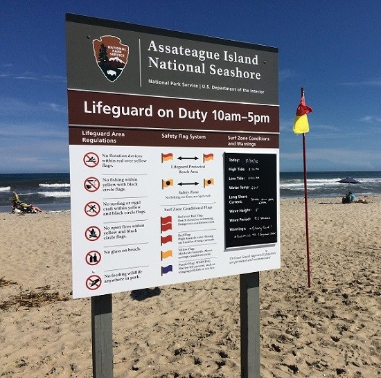 Lifeguard sign and safety flag at Assateague Island National Seashore Lifeguard sign and safety flag at Assateague Island National Seashore