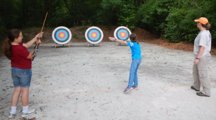 Atlatl throwing at Camp for All Seasons Archeologist instructing Girl Scouts how to throw Atlatl at Camp for All Seasons