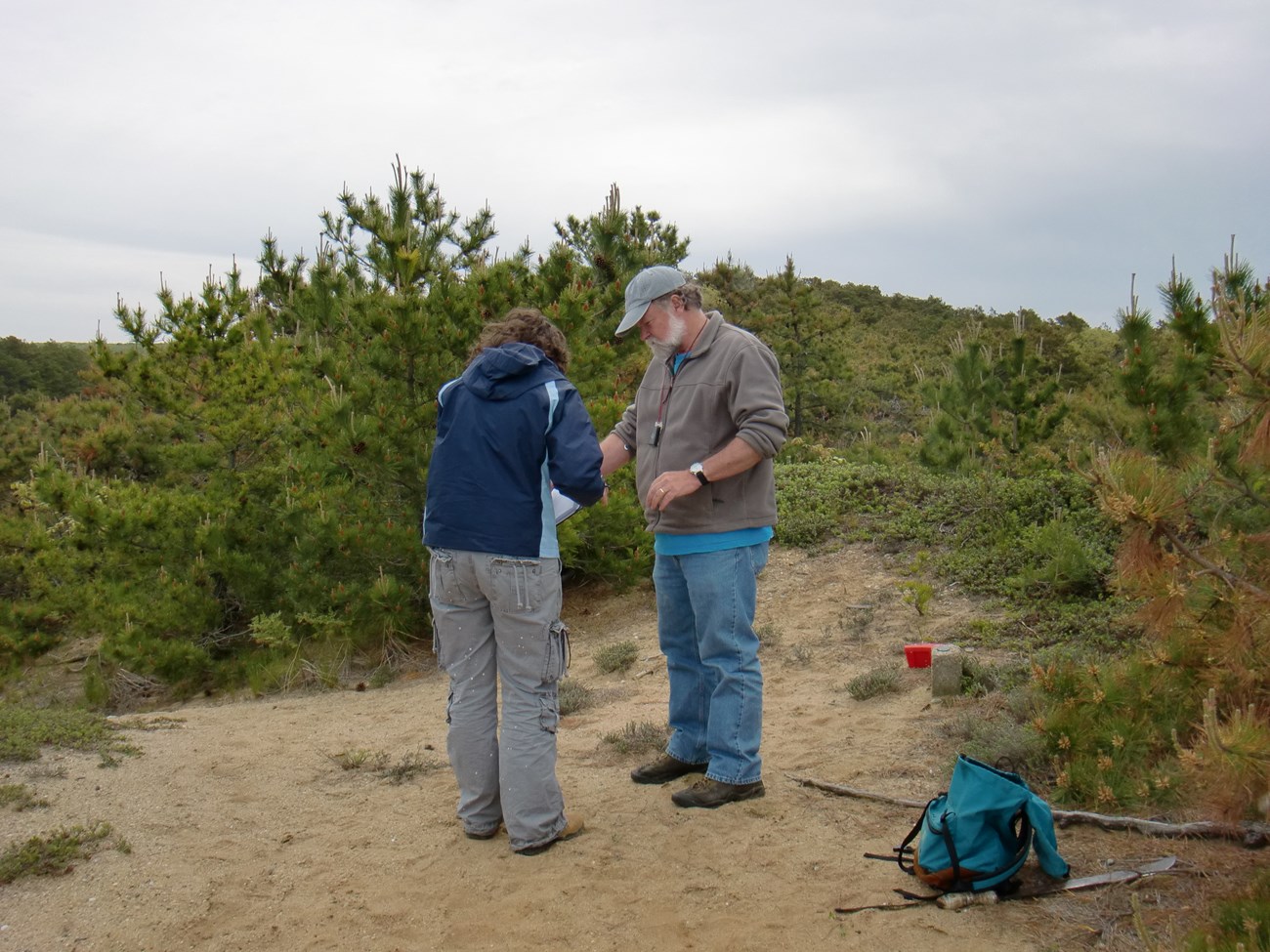 Pete august and crew member record data on a dune