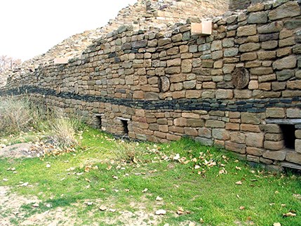 Mysterious green stripe of greywacke stone along the western wall of Aztec West