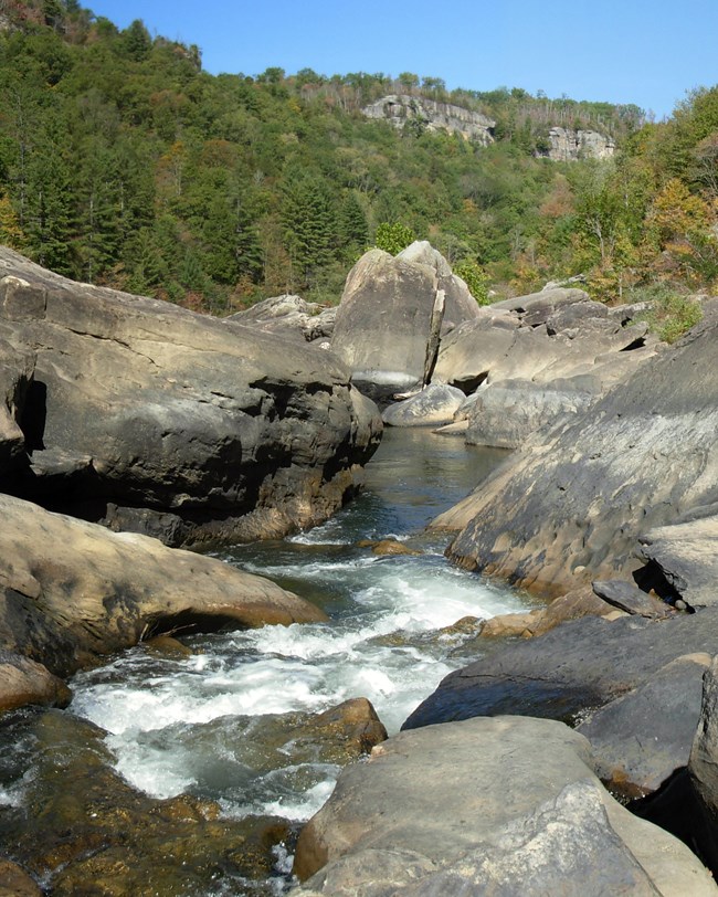 boulders and river at angel falls rapids