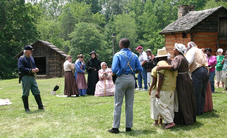 Reeanctors portraying a Union soldier talking to the Washington family