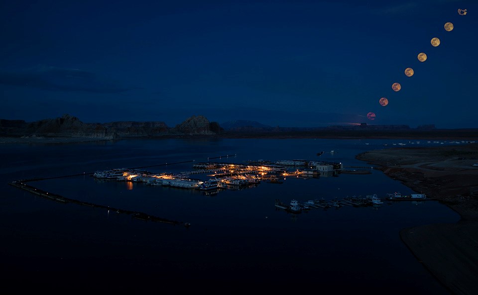 Wahweap Marina Moonlapse Night pic of houseboat marina on lake. Rising moon.
