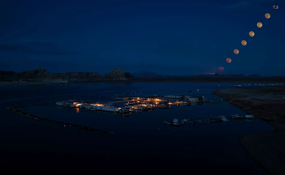 Wahweap Marina Moonlapse Night pic of houseboat marina on lake. Rising moon.