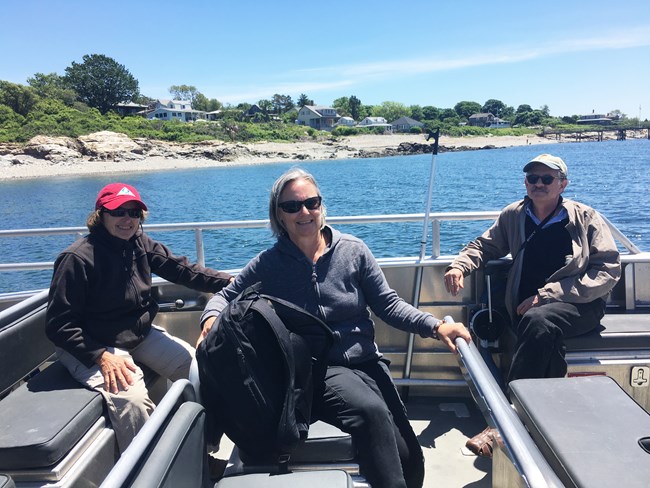 (Left to right) Annie Harris, Shaun Eyring and Peter Samuel aboard the Naumkeag just off the shore of Bakers Island