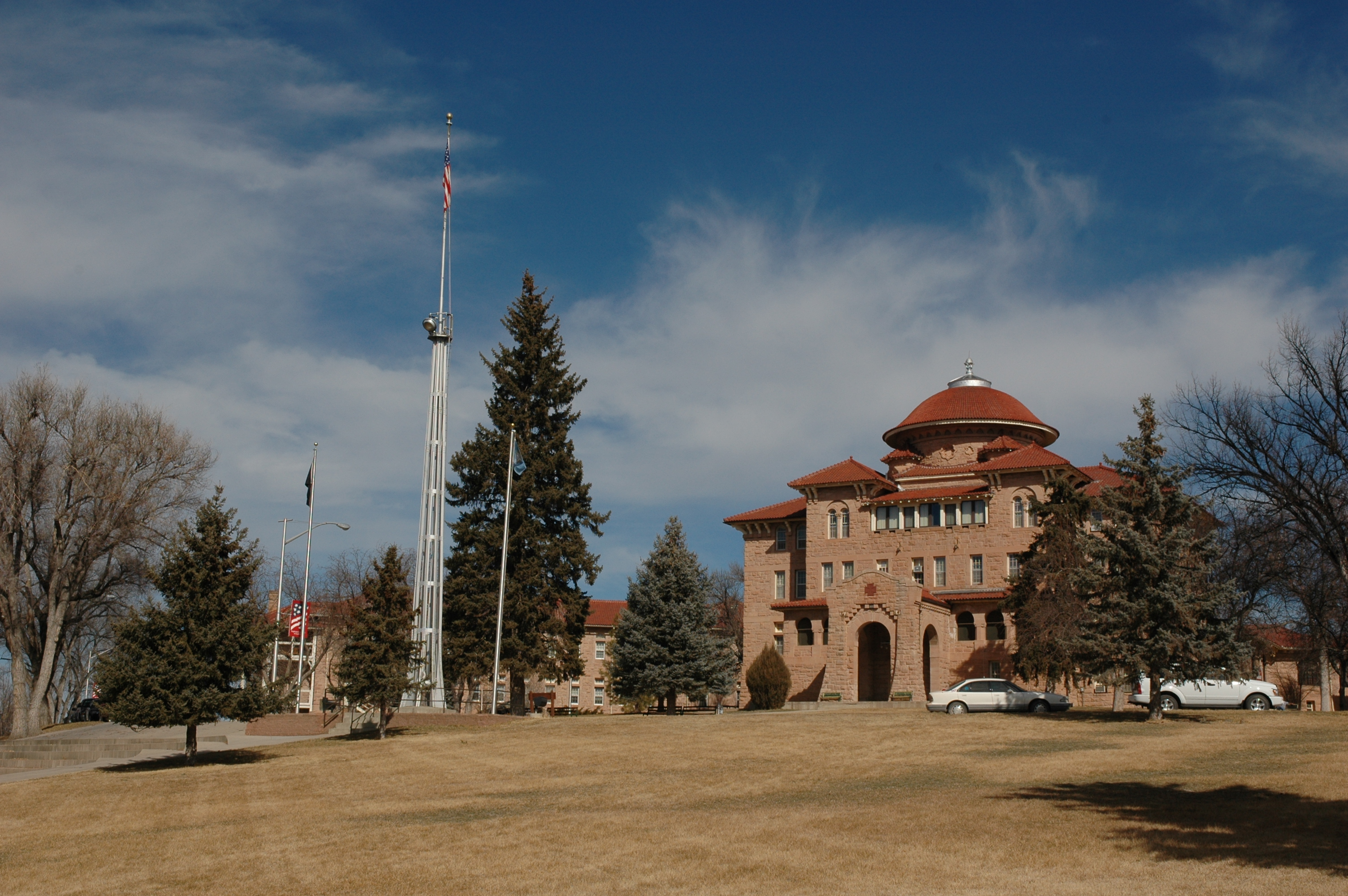 Battle Mountain Sanitarium Administration Building Tall brown building with a dome and red roof.
