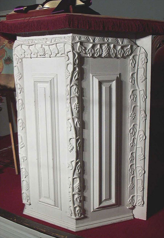 lt= A carved white podium