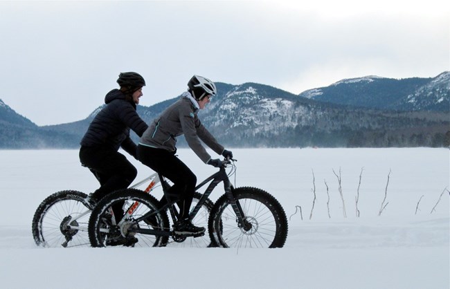 Big tire bike riders on snowy roads