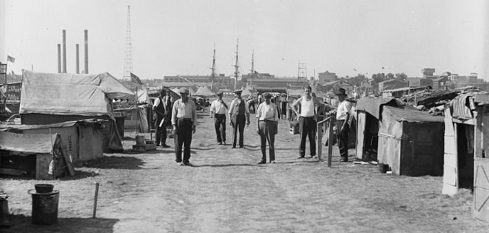 Men stand in the BEF camp.