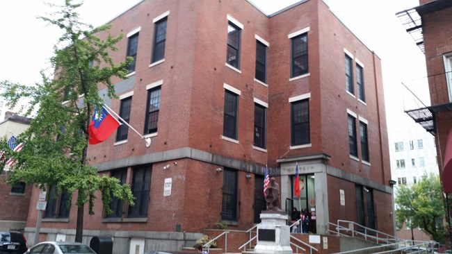 BostonMA_FormerQuincySchool Three story building with broad brick pilasters.