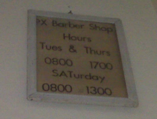 vintage sign. text. Barber shop hours. Tuesday and Thursday. 0800 1700. Saturday. 0800 1300.