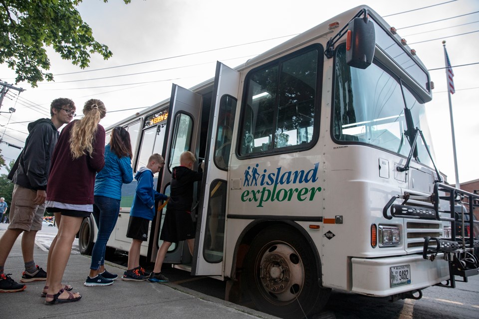 Riders board a bus