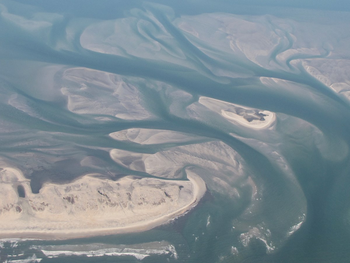 aerial photo of coastal sediment bars and channels aerial photo of coastal sediment bars and channels