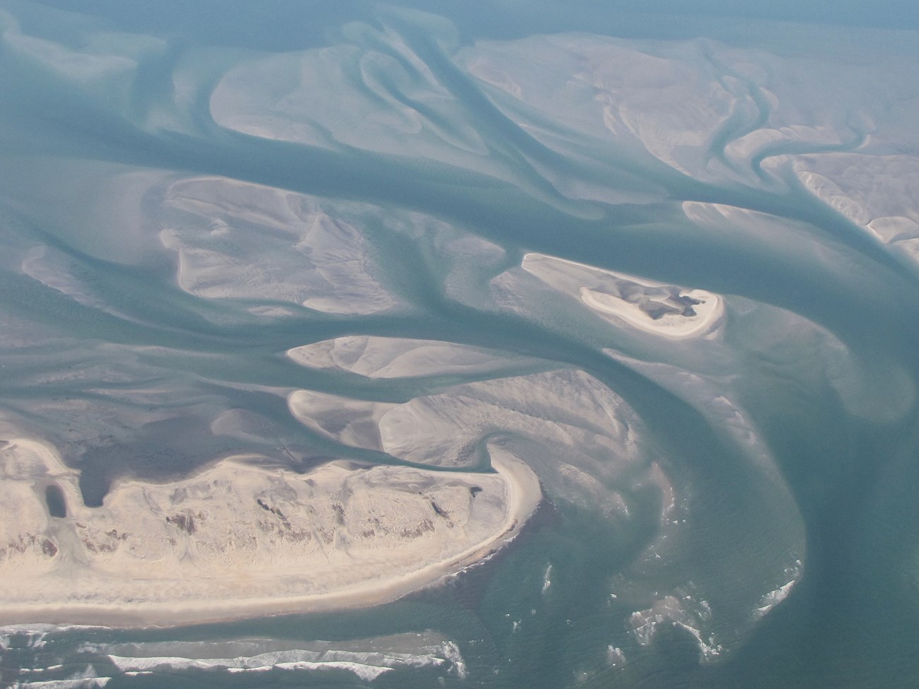 aerial photo of coastal sediment bars and channels