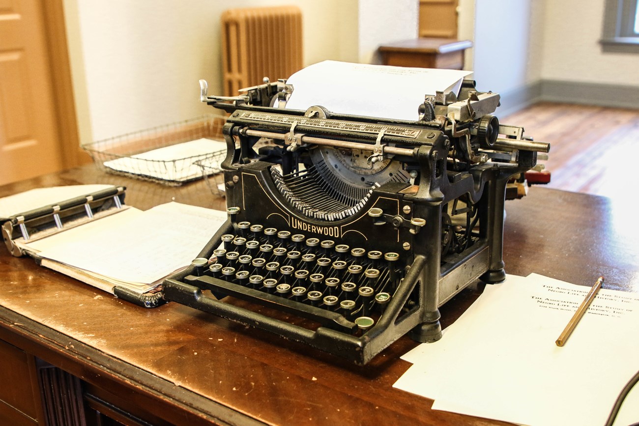 Woodson's Typwriter Typewriter and papers on a desk