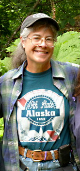 C. Elaine Furbish Woman with glasses and baseball cap smiling