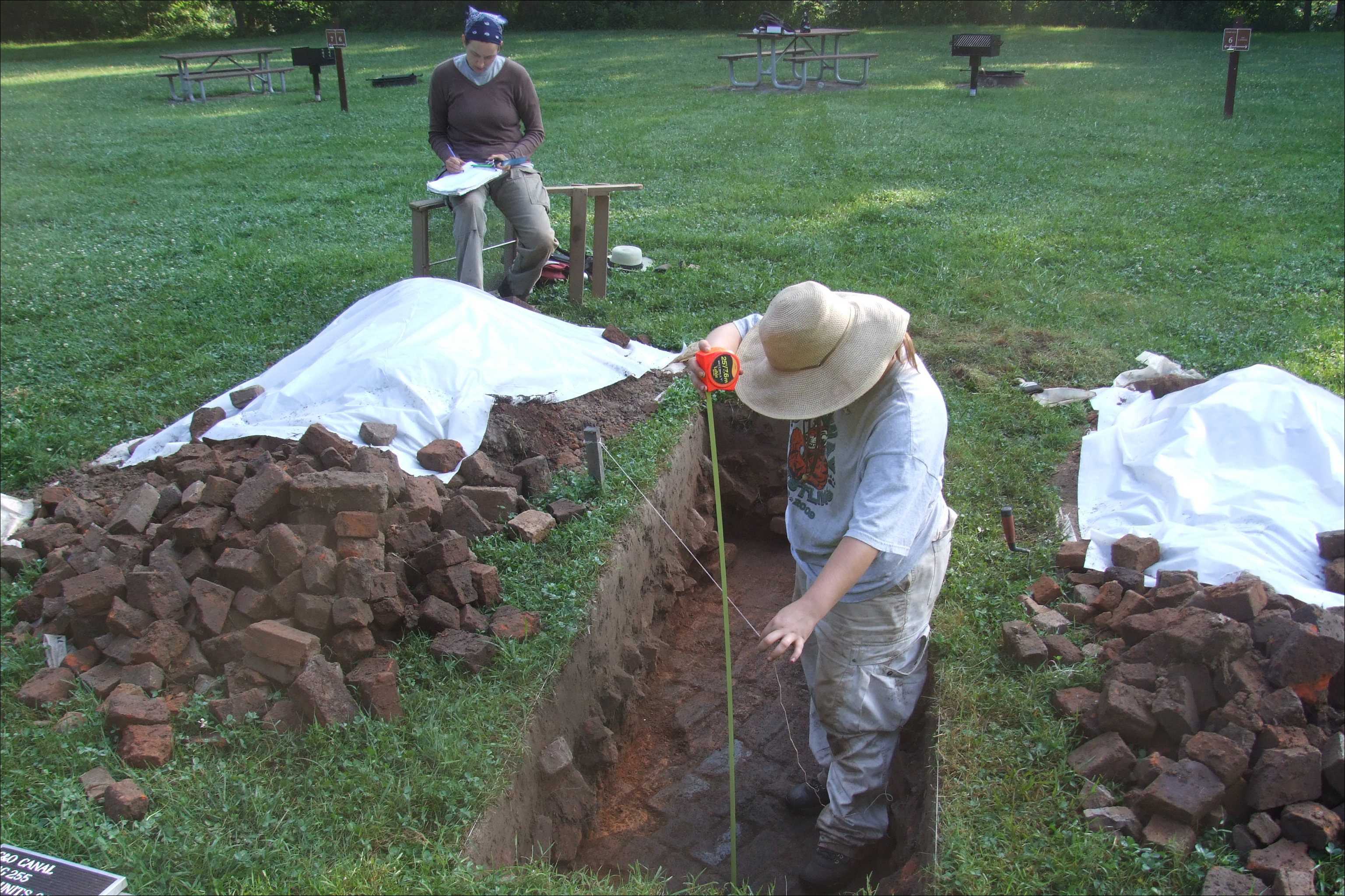 Woman excavating a brick clamp