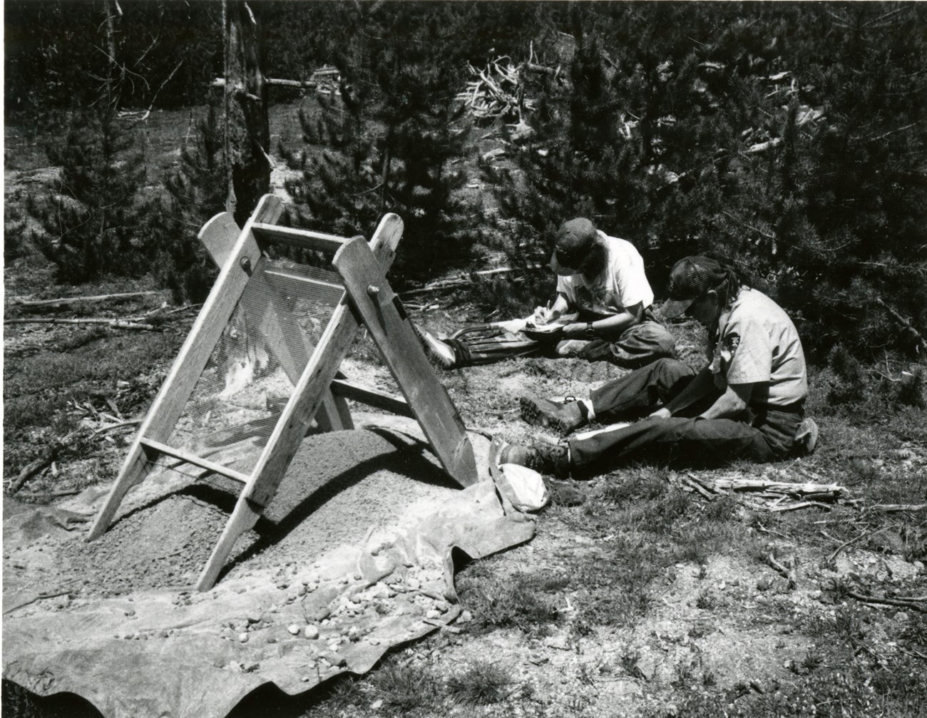 CLAYTONHALE Two archeologists work on a road project excavation