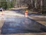 Asphalt patches checkerboard the parkway Asphalt patches checkerboard the parkway