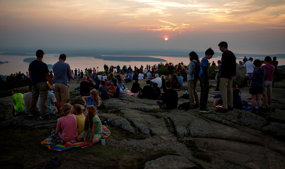 Visitors crowd to watch sunrise on Cadillac Mountain Visitors crowd to watch sunrise on Cadillac Mountain