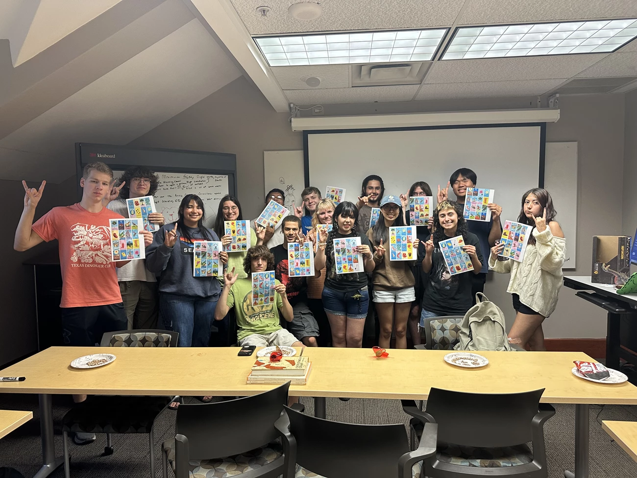 Canamar_image_4_group_newer Group photo of Texas Dinosaur Club members holding up their Paleotería boards after a successful playthrough