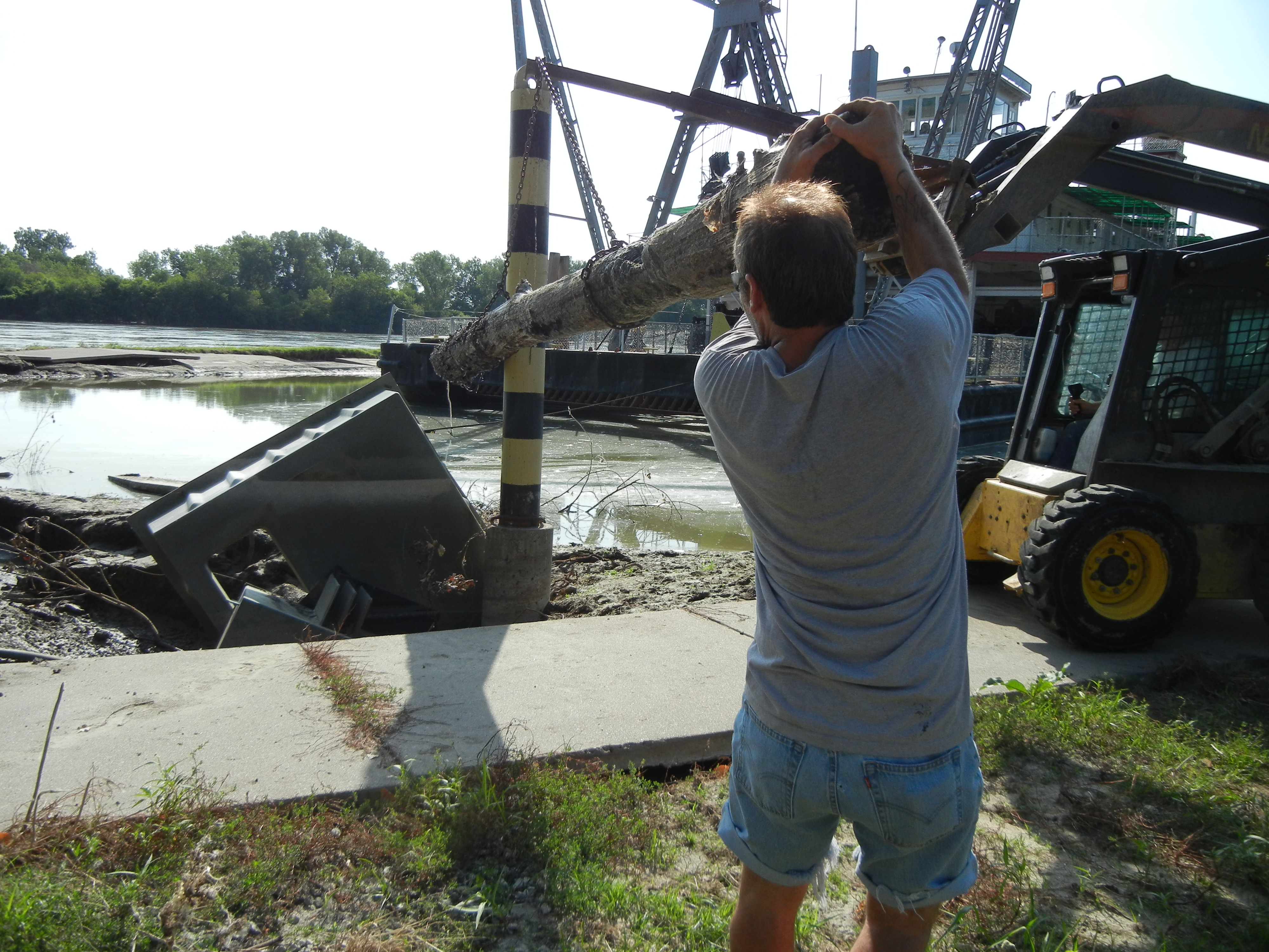 Captain Meriwether Lewis Man holding onto a log connected to machinery.