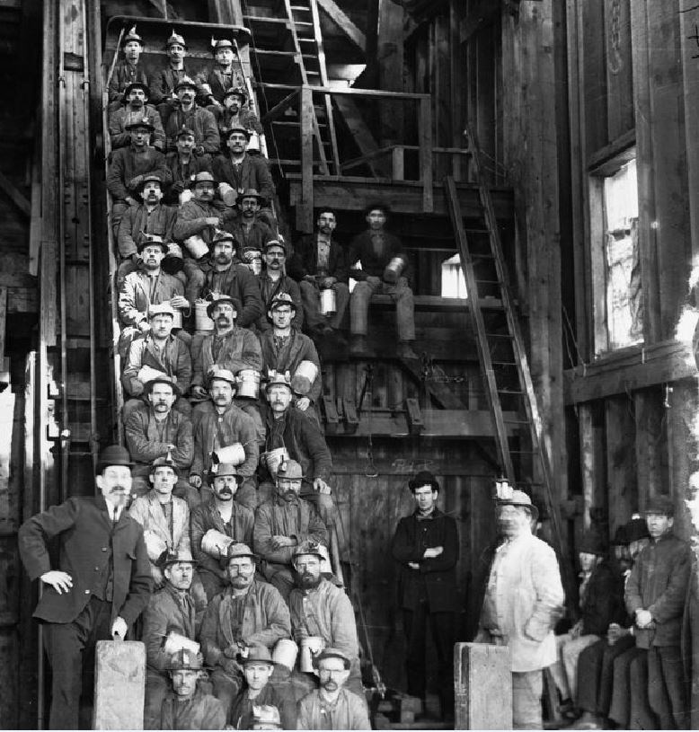 Group of miners posing for picture.