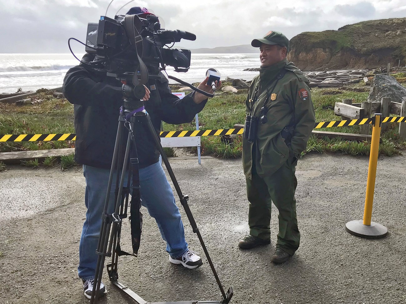 Ranger Carlo Arreglo Uniformed park ranger faces a camera operator during an interview